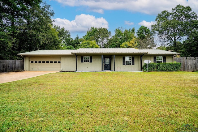 single story home with a garage and a front yard