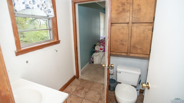 bathroom with tile patterned floors, vanity, and toilet