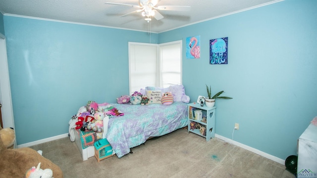 carpeted bedroom with ceiling fan and crown molding