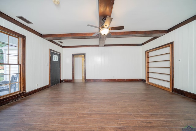 1230 Myrtle, Kilgore, TX 75662 - unfurnished room with beamed ceiling, wood finished floors, a ceiling fan, and wood walls