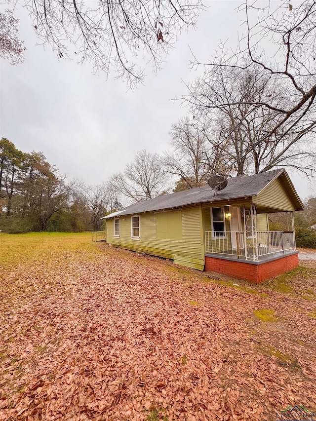 view of property exterior with covered porch