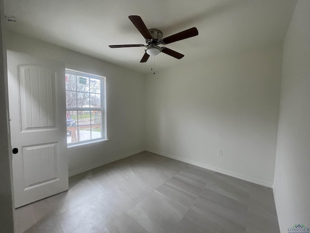 unfurnished room featuring ceiling fan