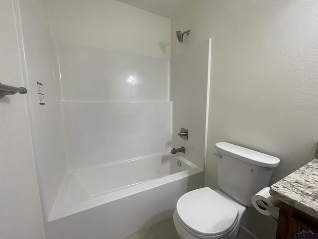 full bathroom with vanity, tile patterned floors, washtub / shower combination, and toilet