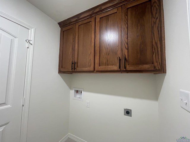 washroom featuring cabinets, hookup for a washing machine, and electric dryer hookup