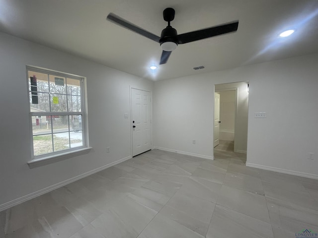 unfurnished room with ceiling fan