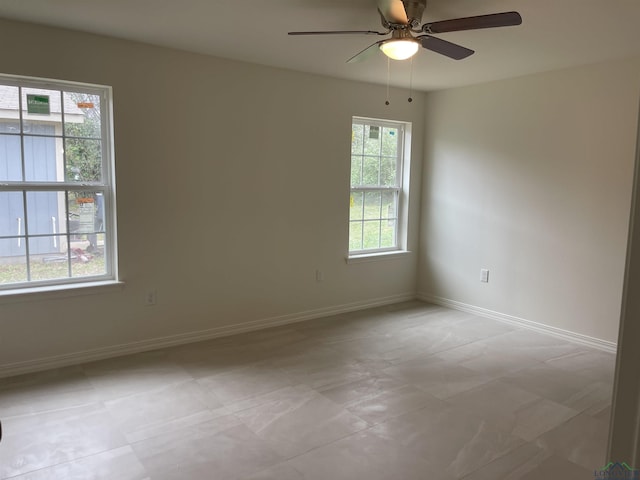 unfurnished room featuring ceiling fan