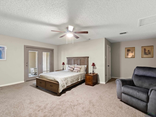 bedroom with ceiling fan, a textured ceiling, access to outside, and light carpet