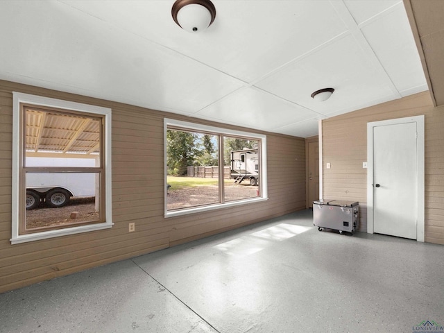 interior space featuring wooden walls