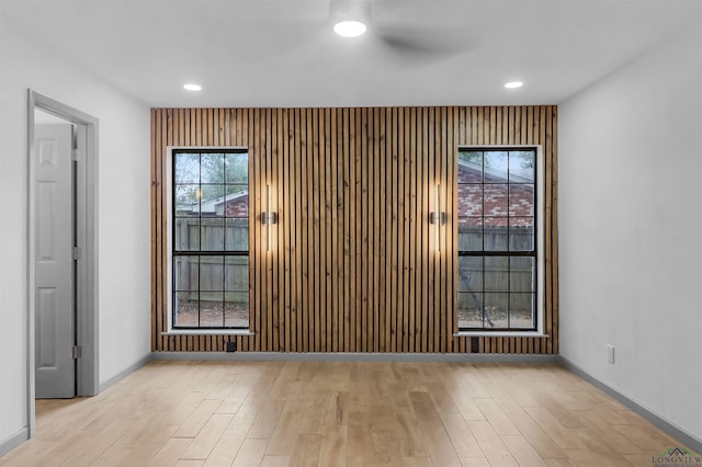 spare room featuring light hardwood / wood-style floors