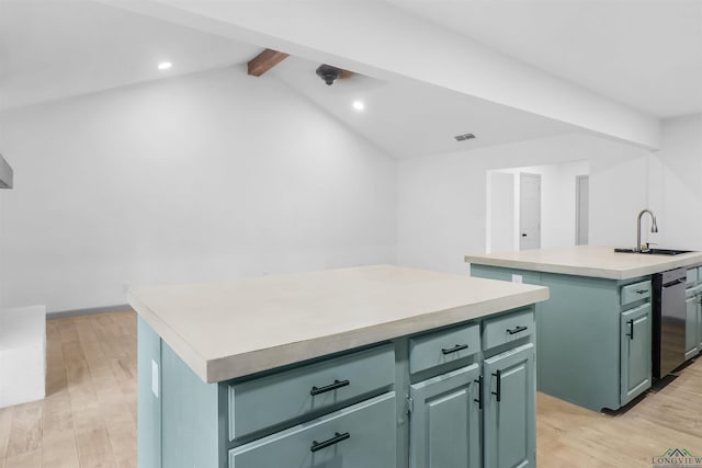 kitchen featuring dishwasher, sink, vaulted ceiling with beams, an island with sink, and light hardwood / wood-style floors