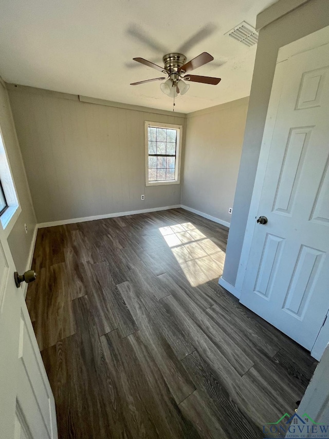 616 W Center St, White Oak, TX 75693 - empty room with ceiling fan, baseboards, and dark wood-style floors