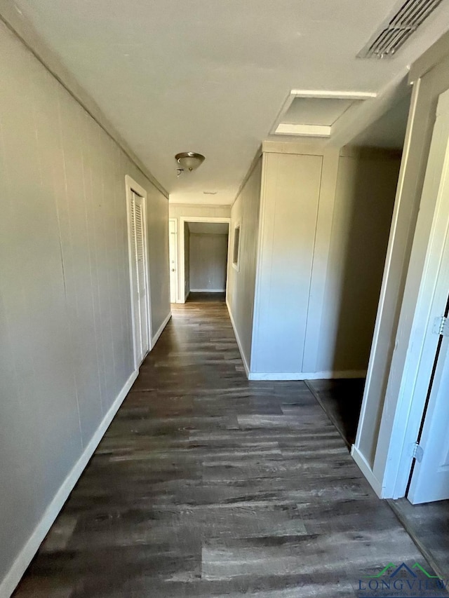 616 W Center St, White Oak, TX 75693 - corridor with baseboards, dark wood-style flooring, and attic access