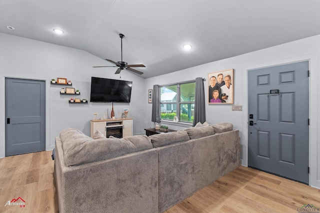 3315 N US Highway 259, Kilgore, TX 75662 - living room with ceiling fan, lofted ceiling, light wood-style flooring, a brick fireplace, and recessed lighting