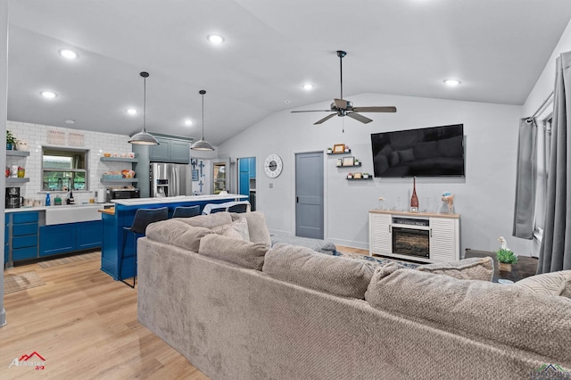 3315 N US Highway 259, Kilgore, TX 75662 - living area with light wood-style flooring, lofted ceiling, a ceiling fan, recessed lighting, and a fireplace