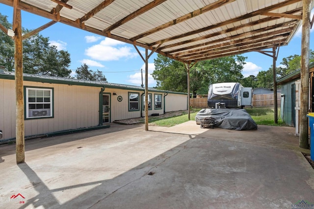 3315 N US Highway 259, Kilgore, TX 75662 - view of patio featuring fence and a carport