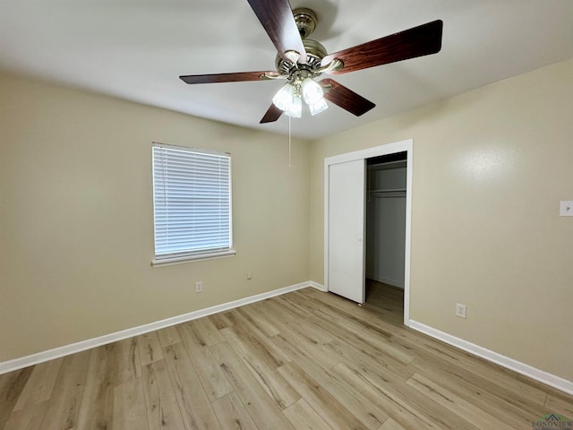 1506 Scenic Dr, Longview, TX 75604 - unfurnished bedroom with light wood-style flooring, baseboards, a closet, and ceiling fan