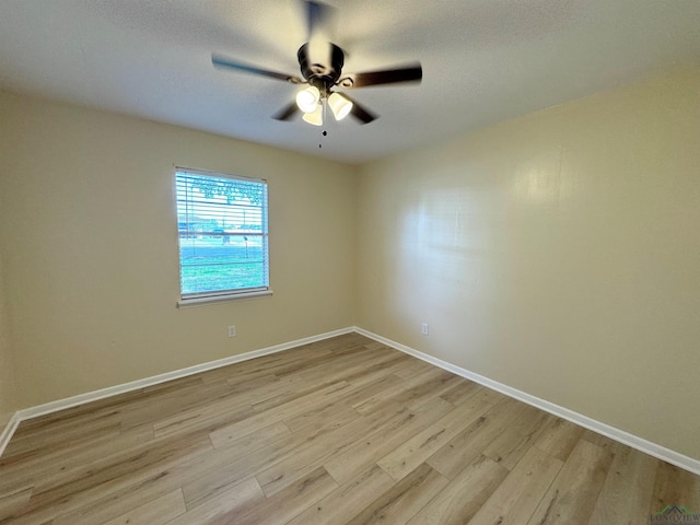 1506 Scenic Dr, Longview, TX 75604 - unfurnished room featuring ceiling fan, light wood-style floors, and baseboards