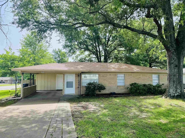 1506 Scenic Dr, Longview, TX 75604 - ranch-style house with driveway, brick siding, a front lawn, and a carport