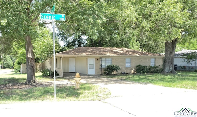1506 Scenic Dr, Longview, TX 75604 - single story home featuring driveway and a carport