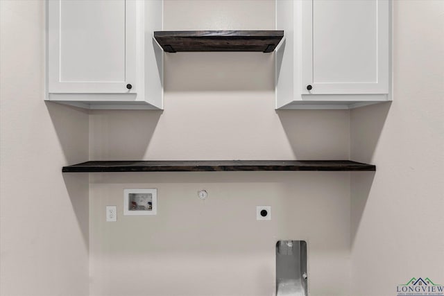 clothes washing area featuring gas dryer hookup, cabinets, hookup for a washing machine, and hookup for an electric dryer