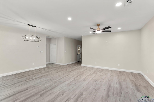 unfurnished room with ceiling fan and light hardwood / wood-style flooring