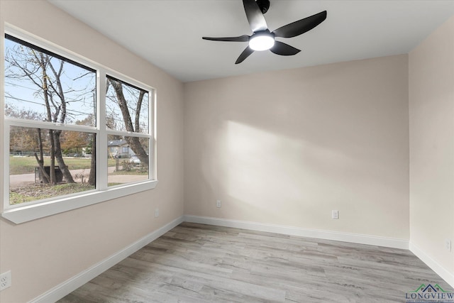 unfurnished room featuring ceiling fan and light hardwood / wood-style flooring