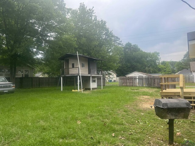 1609 Bomar St, Marshall, TX 75670 - view of yard featuring a deck
