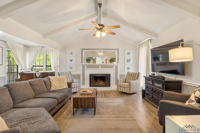 10887 Knollwood Dr, Tyler, TX 75703 - living area with light wood-type flooring, a ceiling fan, and a fireplace with raised hearth