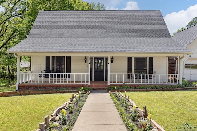 10887 Knollwood Dr, Tyler, TX 75703 - view of front of house with covered porch, a front lawn, and roof with shingles