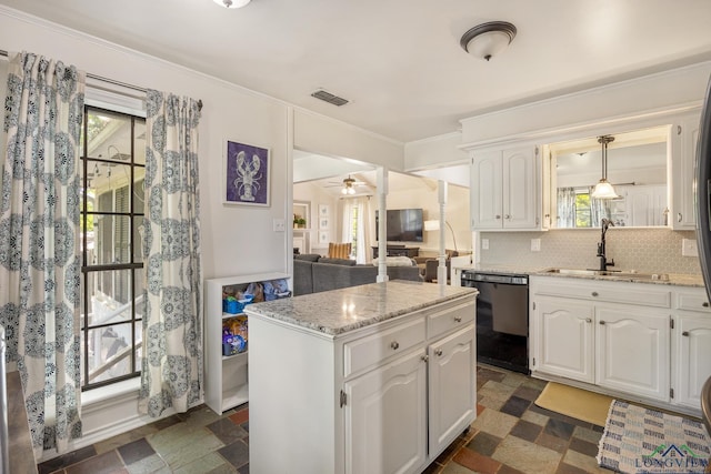 10887 Knollwood Dr, Tyler, TX 75703 - kitchen featuring black dishwasher, a sink, white cabinetry, tasteful backsplash, and light stone countertops