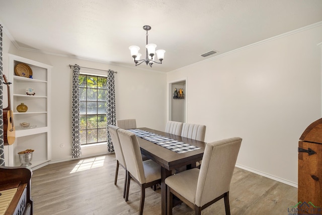 10887 Knollwood Dr, Tyler, TX 75703 - dining room featuring a chandelier, light wood-type flooring, ornamental molding, and baseboards
