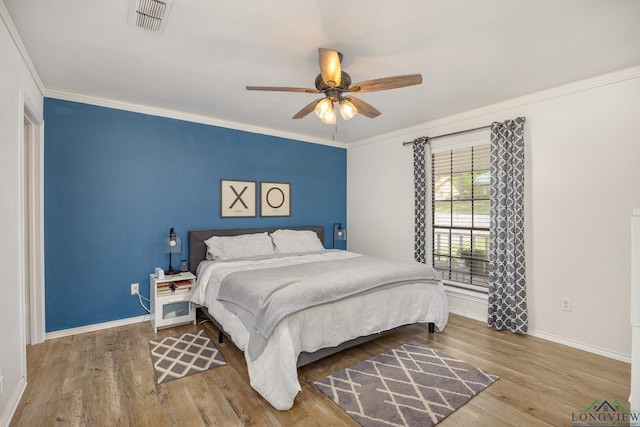 10887 Knollwood Dr, Tyler, TX 75703 - bedroom with baseboards, wood finished floors, crown molding, and a ceiling fan