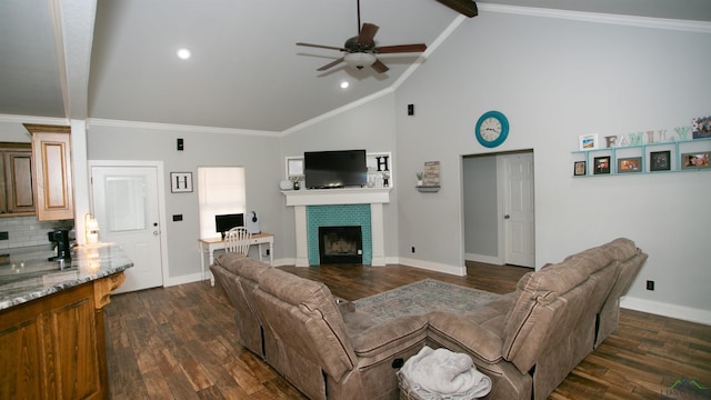 living area featuring dark wood-style floors, crown molding, baseboards, and a tiled fireplace