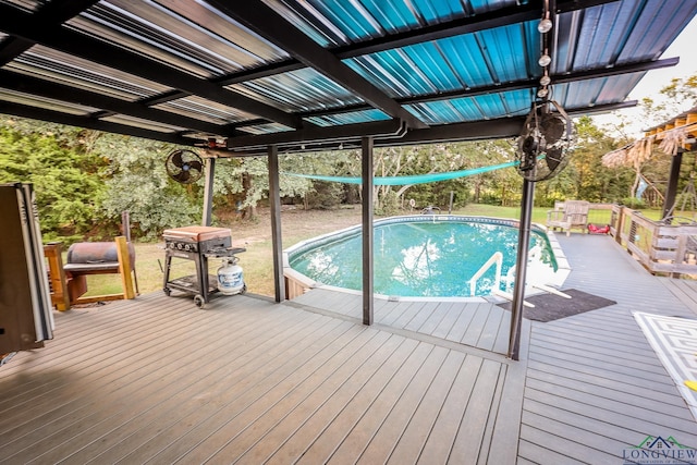 view of pool with a wooden deck