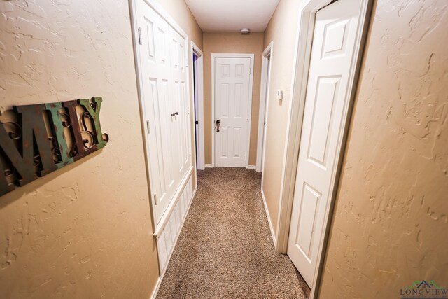 hall featuring carpet floors