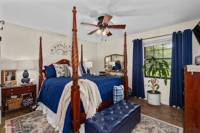 bedroom with a ceiling fan and baseboards