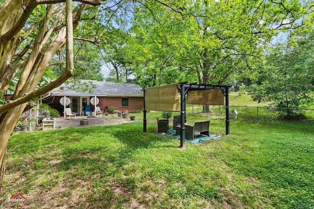 view of yard with a pergola, a patio, and fence