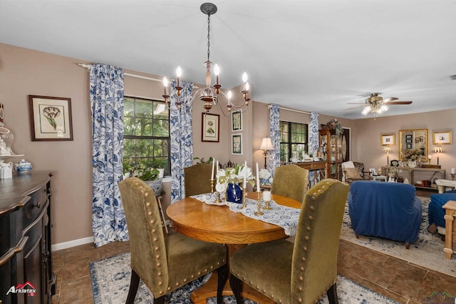 dining room featuring visible vents, baseboards, and ceiling fan with notable chandelier