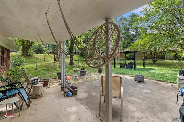 view of patio / terrace featuring fence