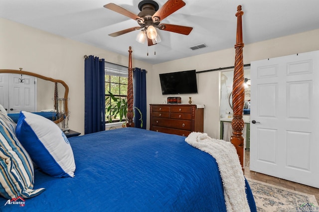 bedroom featuring a ceiling fan and visible vents