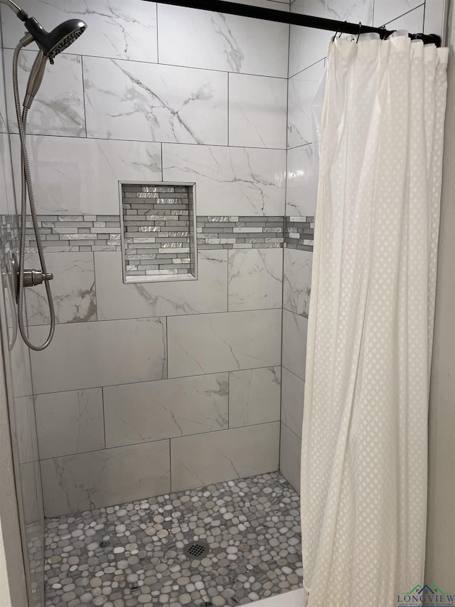 bathroom with a shower with shower curtain