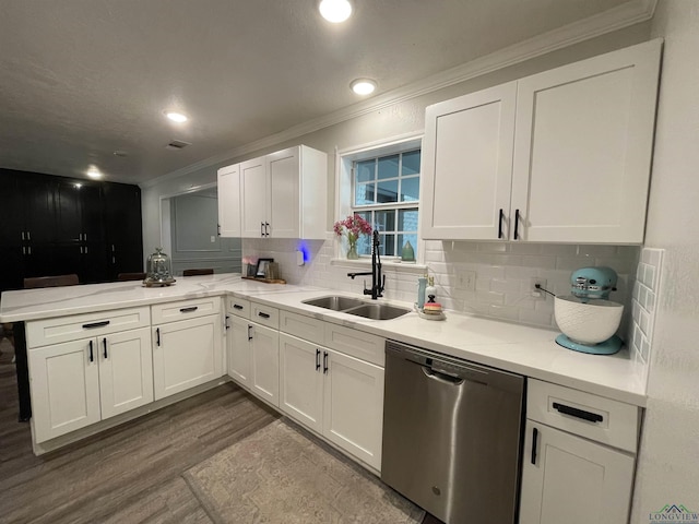 kitchen with stainless steel dishwasher, dark hardwood / wood-style floors, white cabinetry, and sink