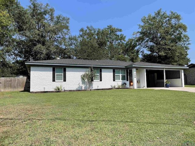 ranch-style house with a carport and a front lawn