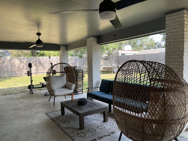 view of patio featuring outdoor lounge area, a trampoline, and ceiling fan