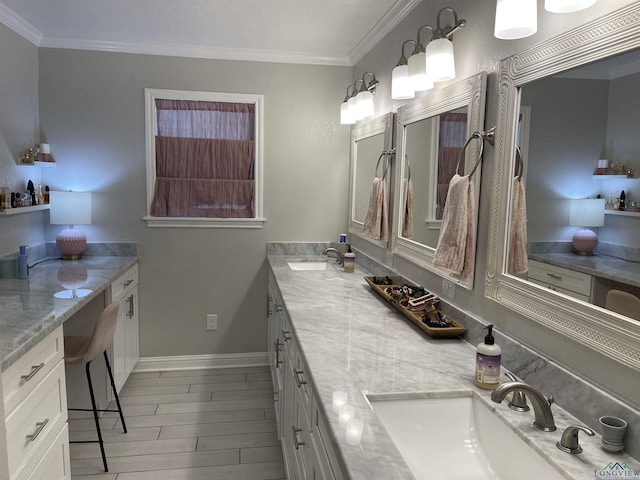 bathroom with vanity and ornamental molding