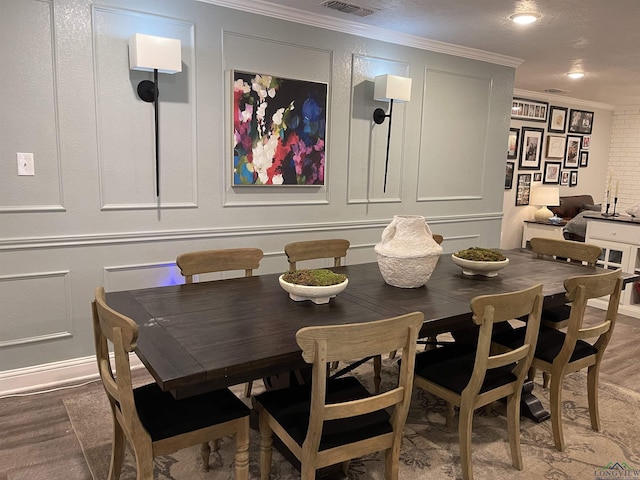 dining area featuring ornamental molding