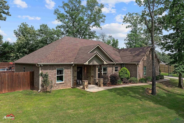 280 Towering Oaks Ln, Longview, TX 75602 - view of front of property with a patio, brick siding, and a shingled roof