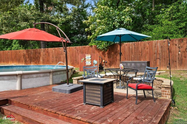 280 Towering Oaks Ln, Longview, TX 75602 - wooden terrace with a fenced backyard and outdoor dining space