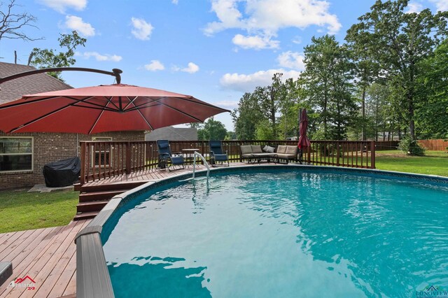 280 Towering Oaks Ln, Longview, TX 75602 - swimming pool featuring a wooden deck and an outdoor hangout area