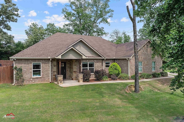 280 Towering Oaks Ln, Longview, TX 75602 - craftsman inspired home with brick siding, a patio, and roof with shingles